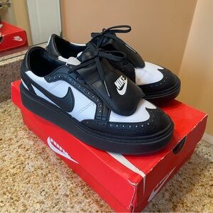 Nike Black and White Sneakers with Leather Upper and Bold Swoosh